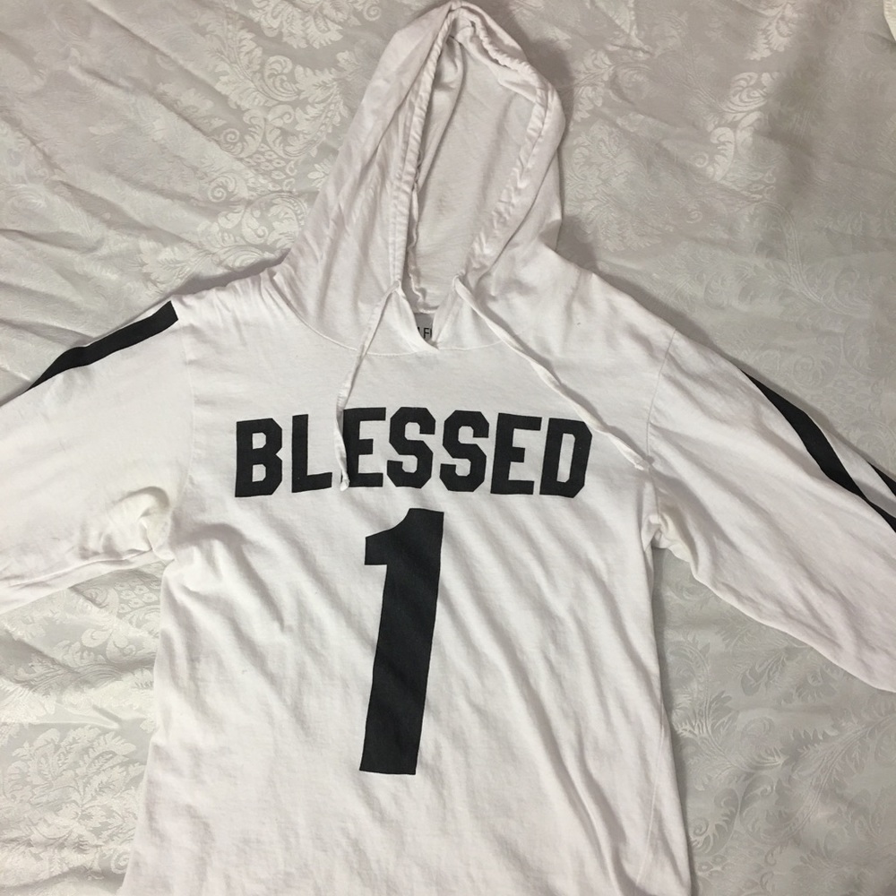 White long sleeve that say blessed!